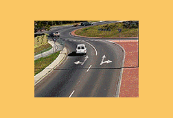 You wish to go straight ahead on this roundabout with two lanes. Which lane may you use?