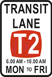 You drive into a transit lane where the T2 rule applies. You have one passenger plus yourself. Are you permitted to remain in the transit lane?