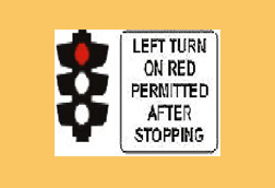 You wish to turn left at this intersection. The traffic lights are red and you see this sign. You should -
