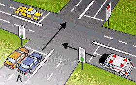 You are approaching a green light in vehicle A. An ambulance sounding its siren is approaching the same intersection and has a red light. You should -