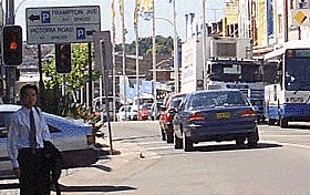 At a pedestrian crossing with traffic lights, when the lights change to red you should -