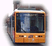 You drive up to a Light Rail vehicle that has just stopped at a tram stop. What is the most important thing you should do?