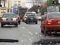 You are driving in busy traffic in a 60 km/h zone. You feel 60 km/h is a bit too fast for the conditions. What should you do?