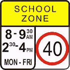 It is 9.20am on a school day. You are driving at 60 km/h, the same speed as traffic around you. You pass this sign but the other cars do not slow down much. What should you do?