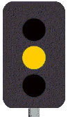 As you approach an intersection with traffic lights, the yellow light turns to red. You must -