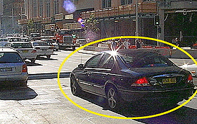 The traffic on the other side of this intersection has stopped.  You are in the car shown and want to cross the intersection.  The lights are green. 