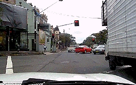 You are waiting at an intersection and the lights are red. The traffic lights change to green. You should-